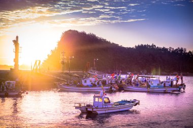 Seoul, South Korea - October 8, 2016: Fishermen boats in small port, toned view. clipart