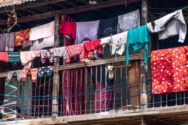 Kathmandu, Nepal - March 18, 2019: nepalese balcony and women clipart