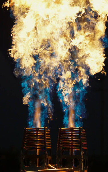 The controlled burn of the power source behind a hot air balloon.