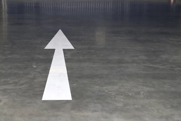 White Arrow Symbol Polished Cement Floor — Stock Photo, Image