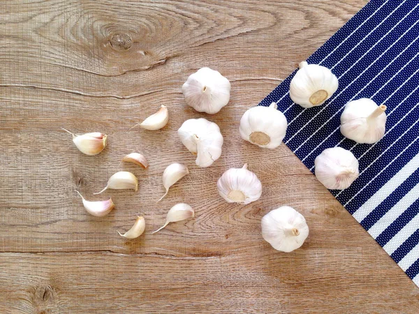 Garlic bulb and garlic cloves on the wooden table. Garlic healthy food.