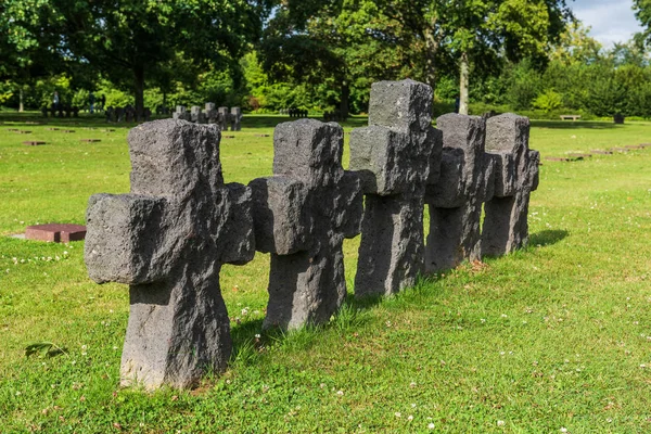 La Cambe is a German war grave cemetery, located close to Bayeux, France. It is reported to contain in excess of 21,000 bodies of German military from World War II. The crosses here are made from grey schist and do not mark individuals graves.