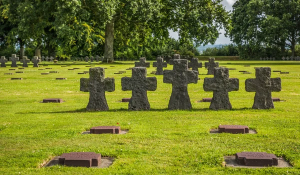 La Cambe is a German war grave cemetery, located close to Bayeux, France. It is reported to contain in excess of 21,000 bodies of German military from World War II. The crosses here are made from grey schist and do not mark individuals graves.