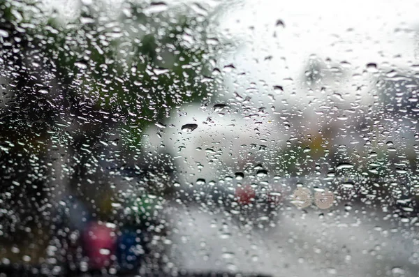 Raindrop on the car glass.