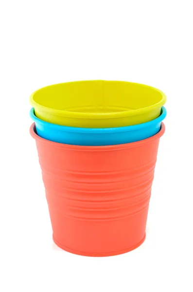 Stacked of three colorful buckets isolated on white background. — Stock Photo, Image