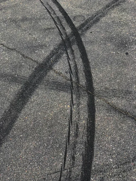 Tire marks on the asphalt.