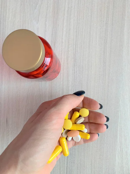 Sleeping pills in a female hand.