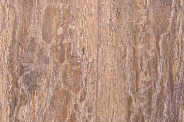 Doğal parlak bir taşın arka planı, mermer. Açık kahverengi tonlarda düz metin, soyut desenler ile.