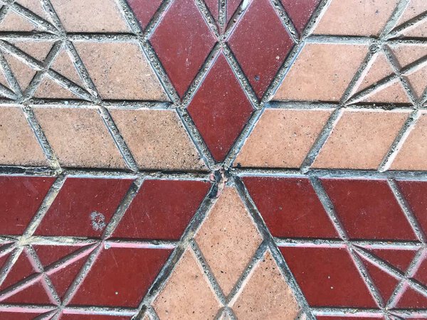 Yellow and Red color Interlocked Tile flooring pattern for passage or streets inside the residential garden pathway or walkway