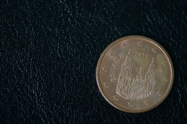 Coin in five euro cents on a dark background close up