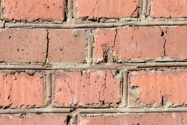 Old brick wall on a sunny day close up. Abstract background