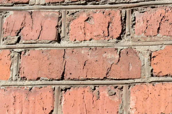 Old brick wall on a sunny day close up. Abstract background
