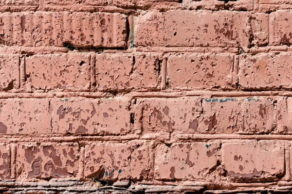 Old brick wall brown color painted texture close up. Abstract background
