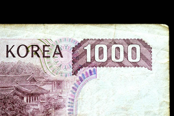 Outdated 1000 Korean Won note of 1983 issued on a black background close-up