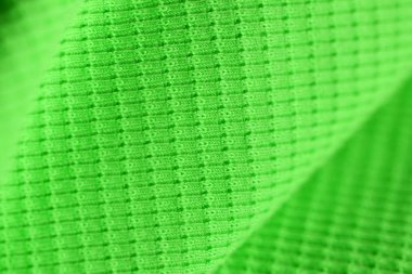 Parlak yeşil renk yakın çekim tekstil yüzeyi. Soyut arka plan