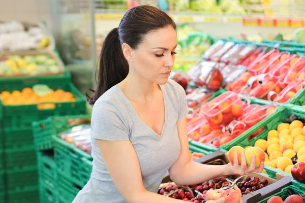 Women Choosing Daily Products Supermarket Reading Product Information Royalty Free Stock Photos