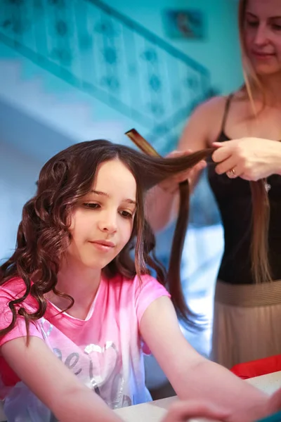 Beautiful Woman Curls Long Hair Girl Using Curling Iron Royalty Free Stock Photos