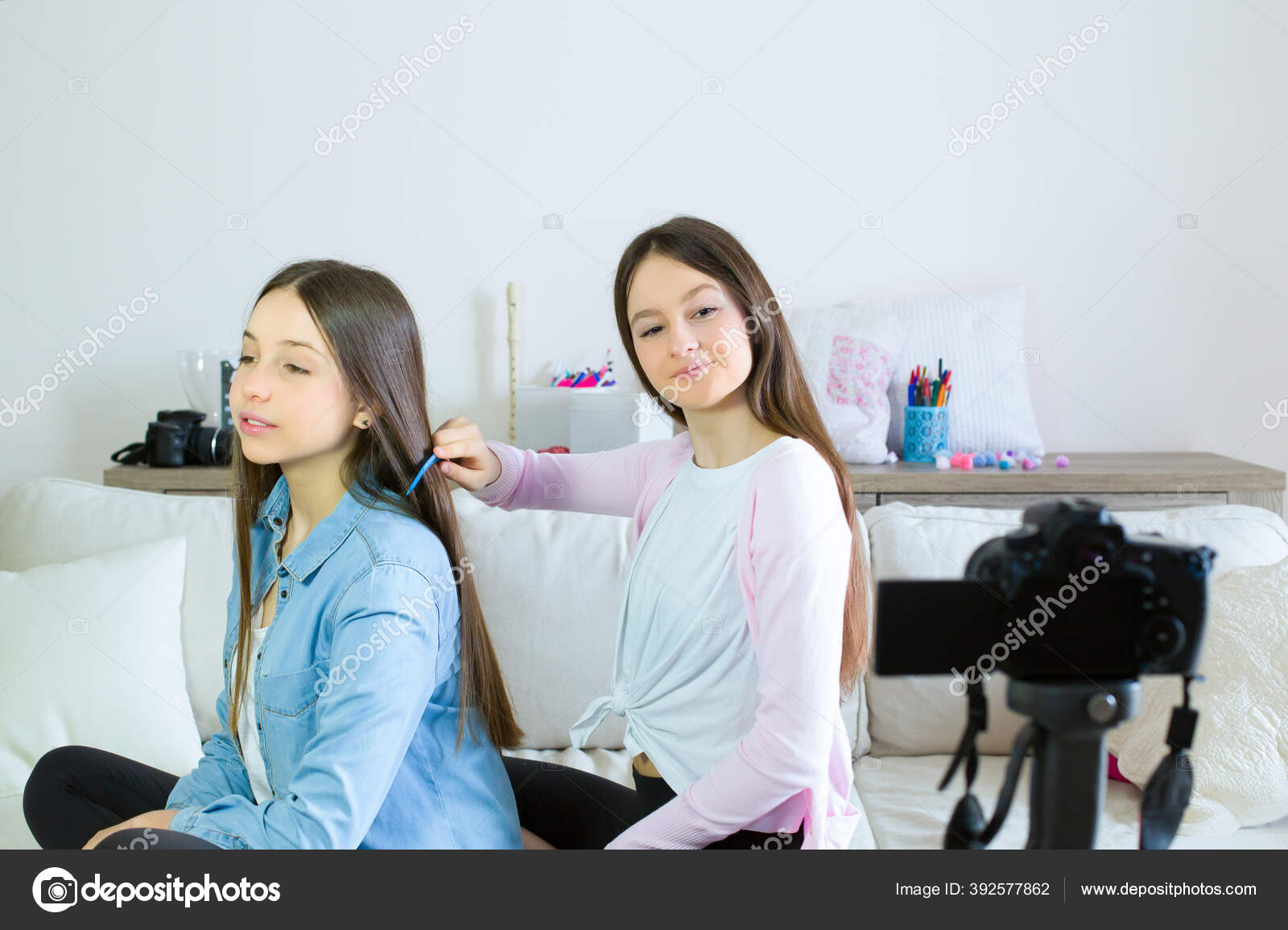 Two Teen Girls Blogger Presents Beauty Products Combs Curling Hair Stock Photo by ©Natiss 392577862