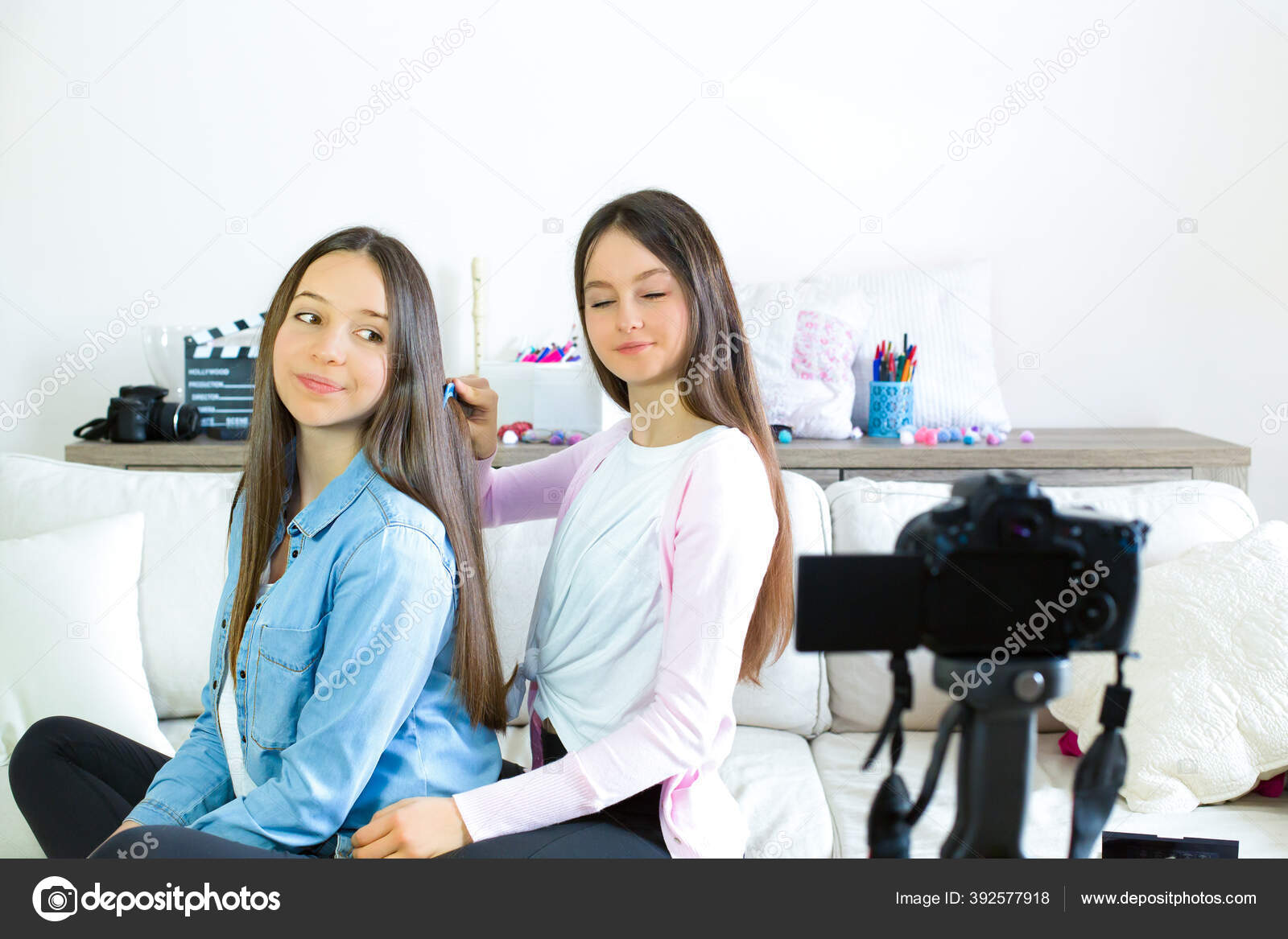 Two Teen Girls Blogger Presents Beauty Products Combs Curling Hair Stock Photo by ©Natiss 392577918