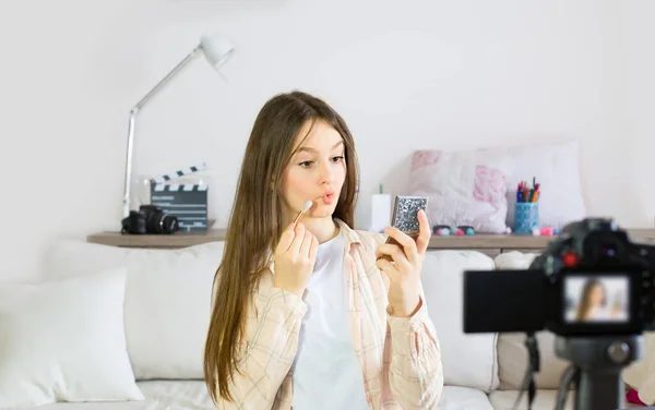 Teen blogger presenting beauty products and broadcasting live videos on social networks. Focus on teen girls influencer bloggers. Beauty bloggers and vlog concept.