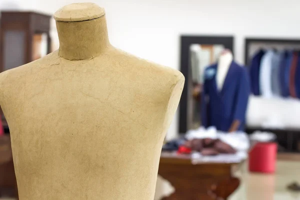 Mannequins in a tailor shop and tailored suits. Concept of: tailoring, businessman, elegance.