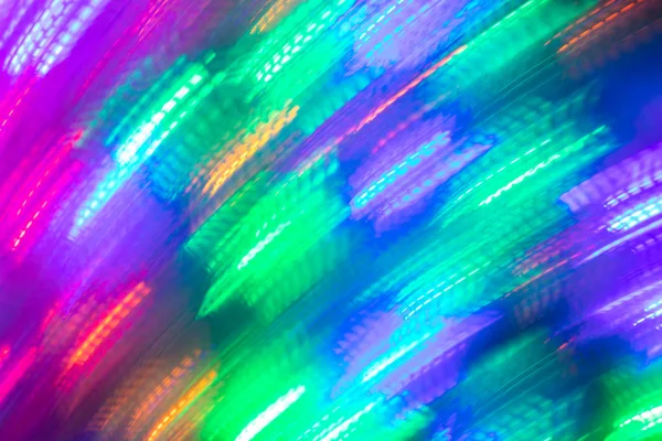 Abstrakte leuchtende nahtlose Hintergrund der verschwommenen Diagonale helles Neonlicht. — Stockfoto