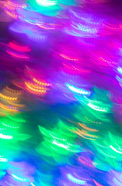 Fundo sem costura luminoso abstrato de luzes de néon multicoloridas borradas . — Fotografia de Stock