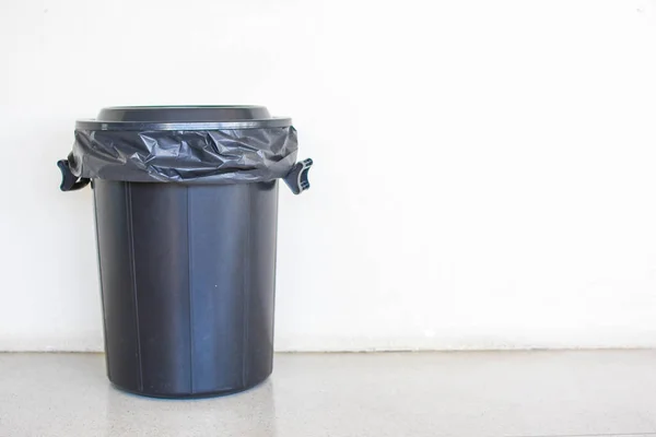 Bin in the background a white wall — Stock Photo, Image