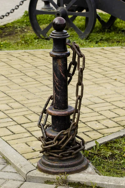 Metal rack wrapped chain close-up.