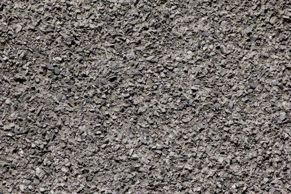 Die Wand Besteht Aus Dunklen Steinsplittern Auf Einer Ebenen Oberfläche — Stockfoto