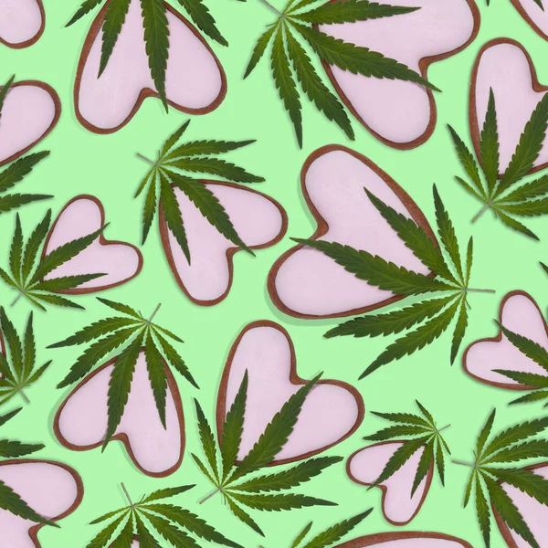 Seamless pattern of hemp leaves and hearts. Pink heart with marijuana leaves on a green background. Valentines day background.Marijuana leaves for medical purposes and heart.Delicate background.