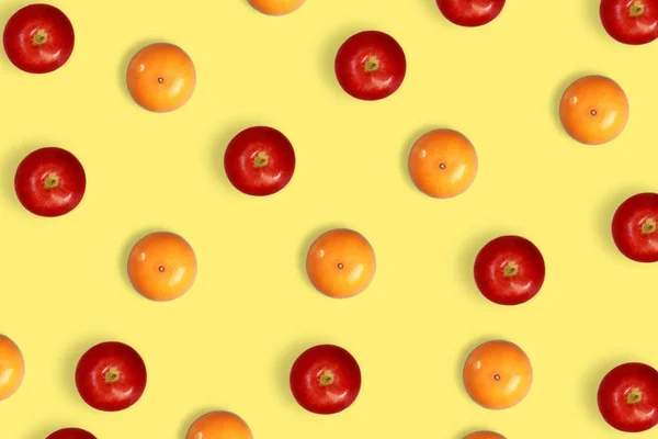orange and apple pattern on yellow pastel background
