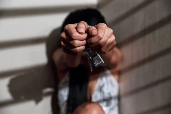 Sexual assault and imprisoned woman in jail with chain waiting for help (this image for girl victim and violence concept) — Stock Photo, Image