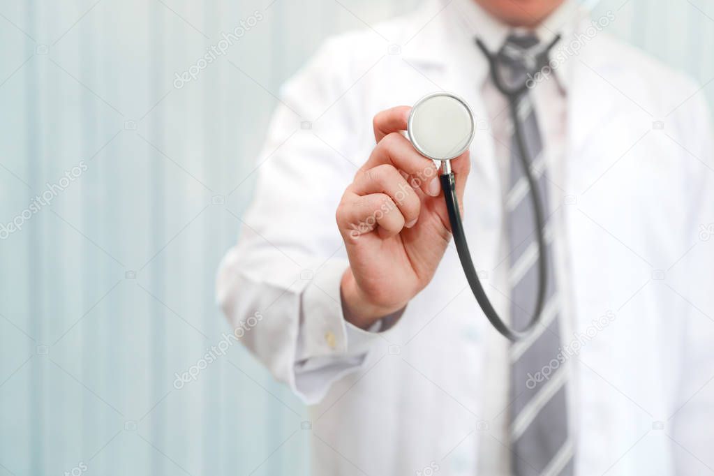 asian doctor portrait using stethoscope