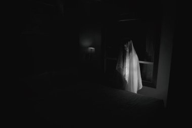 black and white ghost women in haunted hotel with double exposure and dark filter (halloween concept) clipart
