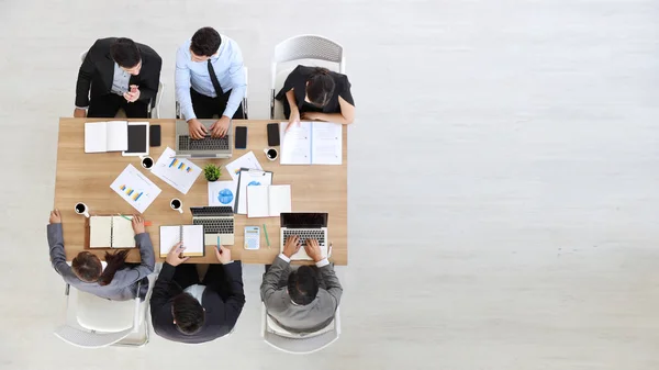 high angle view of multiethnic business people working office desk with right copy space