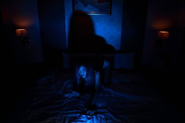 ghost woman in haunted hotel with blue filter, halloween concept clipart