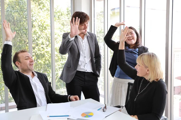 Medium shot multiethnic business people raising hands together meaning of success teamwork concept — Stock Photo, Image