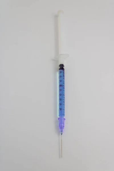 Needle Syringe Isolated Blue Medicine White Background — Stock Photo, Image