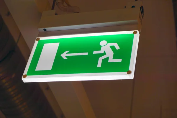 Close up shot of an emergency exit sign.
