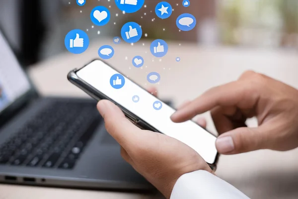 Man person hands holding smartphone for social interaction on social media with notification icons like, heart, comment  message and star, digital marketing and social media concept.