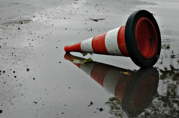 traffic cone on wet road