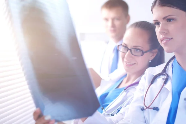 Young group of doctors looking at x-ray — Stock Photo, Image