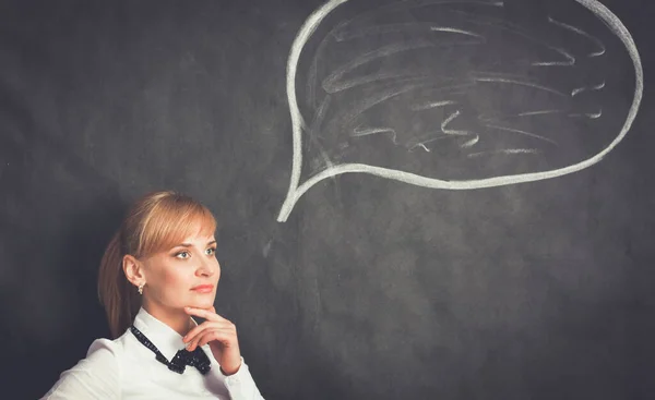 Smiling thinking girl looking with empty bubble — Stock Photo, Image