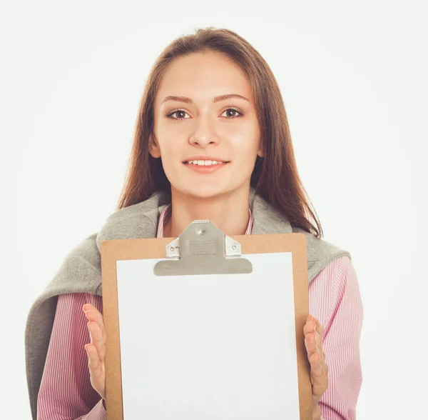 Mujer mostrando una página en blanco del portapapeles Fotos De Stock