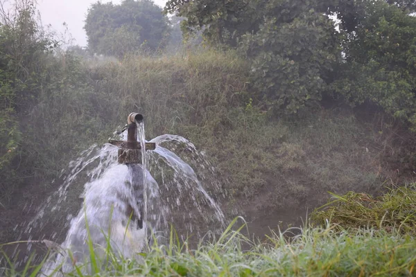 clear sweet and health water overflowing from the water jet on rainy days,