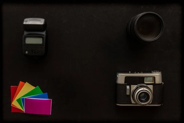 basic photographic equipment, flash,lens, color gels