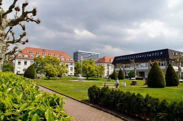 Public hospital building. University hospital with clear blue sky in Mainz Germany. Green grass in public park and building.