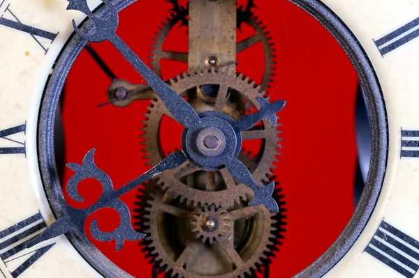 old metal dusty mechanical clock with moving gears and screws. Brass cog wheels, Close view of old rusty clock mechanism with gears and cogs. Element of design. pendulum clock