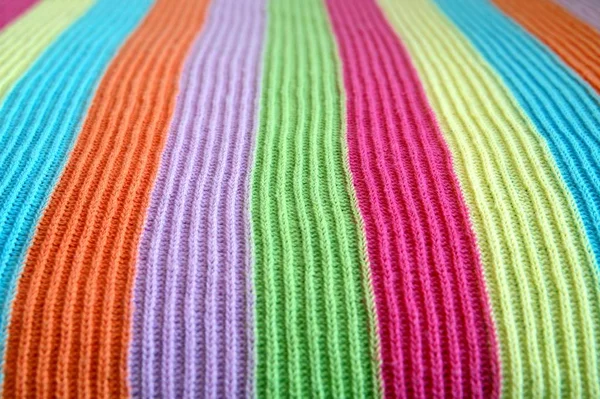 multicolored woolen soft texture striped. striped pattern fabric wool. multicolored woolen soft texture. knitted blanket from multi-colored threads. Knitted texture. Strips Backgrounds.